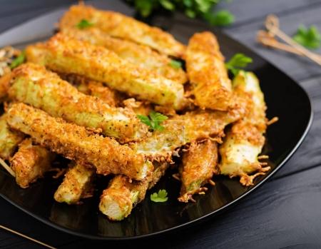Zucchini slices baked under cheese breading