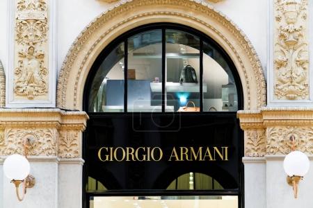 Giorgio Armani Sign on street shop window Milan