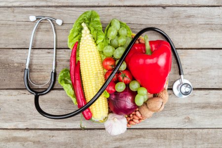 stethoscope, organic vegetables and fruits