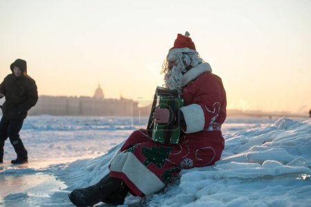 Santa Claus on a bike with an accordion