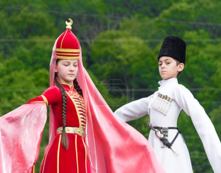 Adyghe girl and boy in national costume on the Circassian ethnic festival in Adygeya