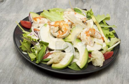 Caesar salad with prawns and avocado
