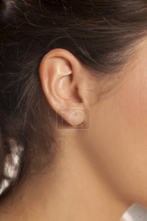female ear and hair