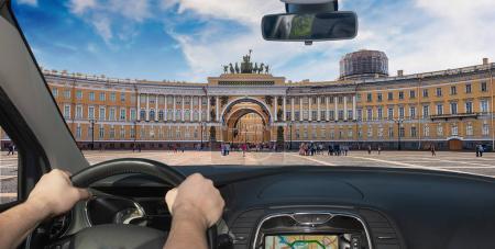 Driving a car in Palace Square, St. Petersburg, Russia