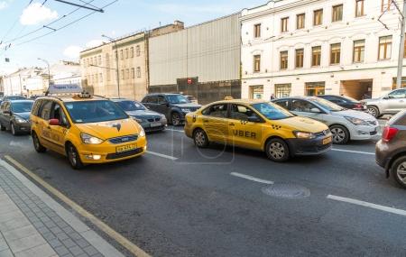 Moscow, Russia - July 24. 2017. Taxi company Yandex and Uber go on prospekt Mira street