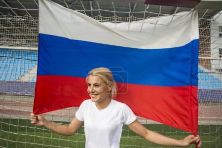 girl holding  in hands Russian flag  