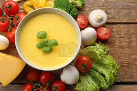 creamy cheese in bowl and fresh vegetables