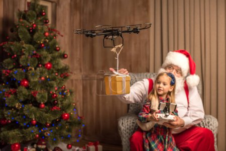 Santa with kid using hexacopter drone 