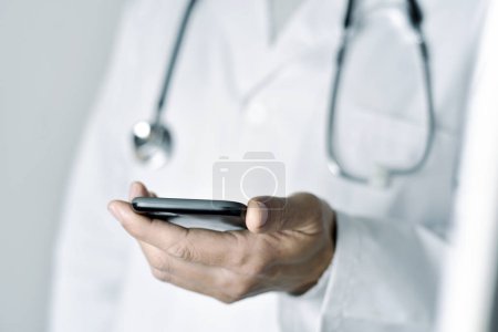 doctor man using a smartphone