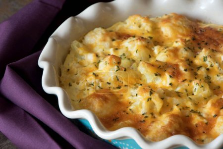 Casserole cabbage is sprinkled with cheese and baked