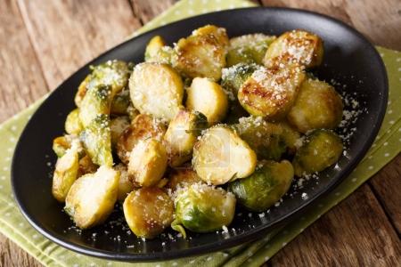 roasted brussels sprouts with garlic and Parmesan cheese on a pl