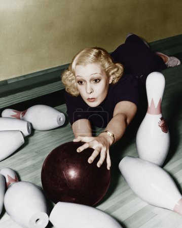 Woman having bowling accident