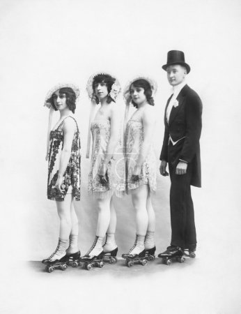 Four on roller-skates standing in a line