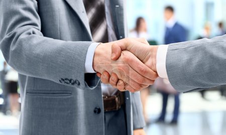 Handshake in front of business