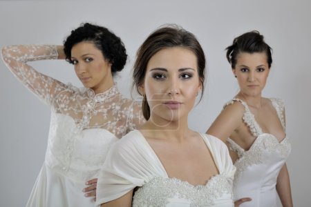 Portrait of a three beautiful woman in wedding dress