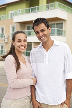 Portrait of a couple in front of building
