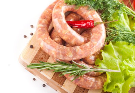 Sausage from pork and beef, tomatoes, salad and spices