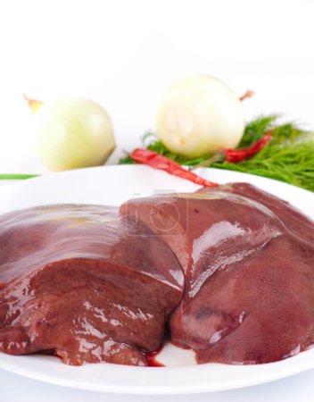 Pork liver with pepper and an onion on a white background