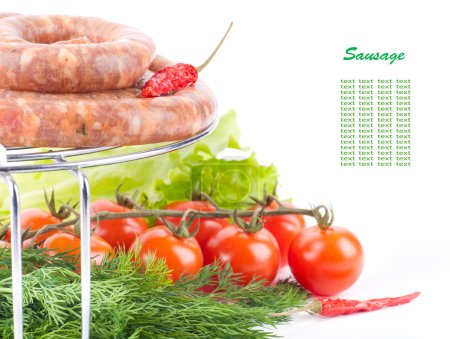 Sausage from pork and beef on a grill, tomatoes, salad and spices