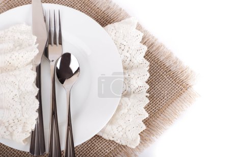 Table fork and knife in a napkin of medieval style