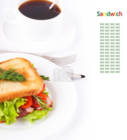 Sandwich from smoked meat and tomatoes, a cup of coffee