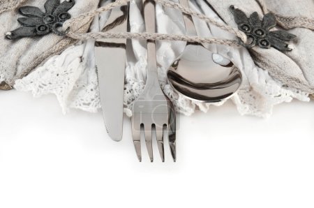 Table fork and knife in a napkin