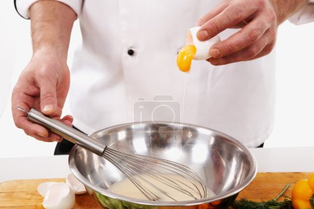 Preparing omelette