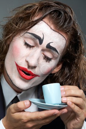 Clown with coffee