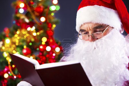 Santa reading a book
