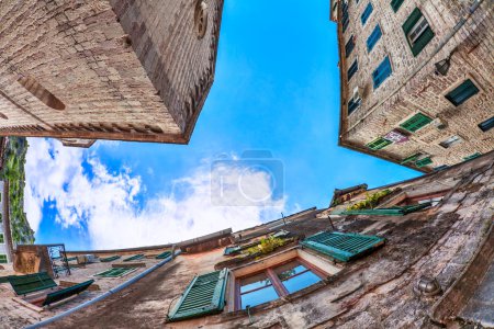 Fish-eye view of the old city on sky background