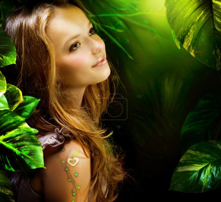 Beautiful Girl in Green Mystical Forest